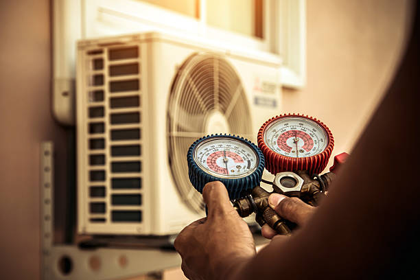 Professional Air Conditioning Service technician working in Wheatfield, IN